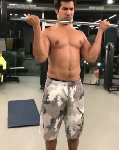  WATCH: Varun Dhawan flaunts his abs as he sweats it out in gym 