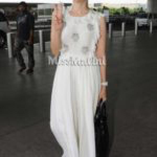 Karisma Kapoor Pairs Her All-White OOTD With The Hottest Shoe Brand