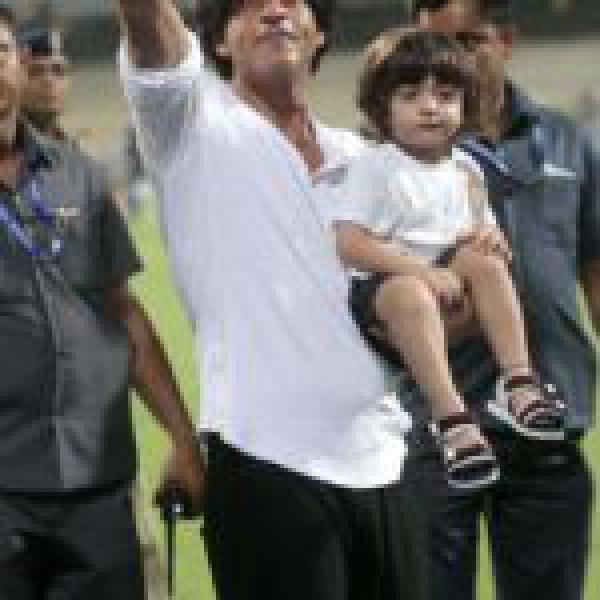 In Photos: Shah Rukh Khan Returns From London With A Sleepy AbRam In Tow