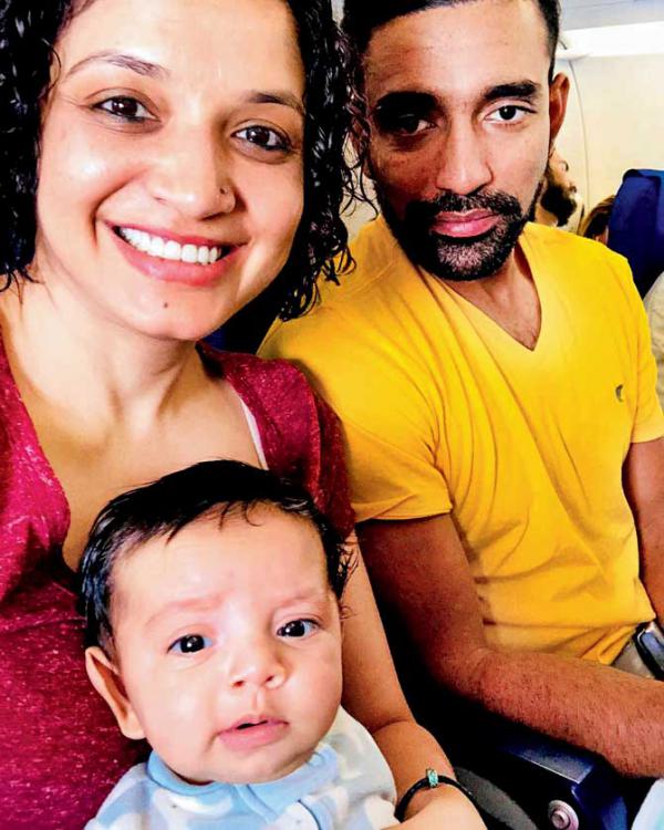 Robin Uthappa and wife Sheethal take baby son Neale on his first flight