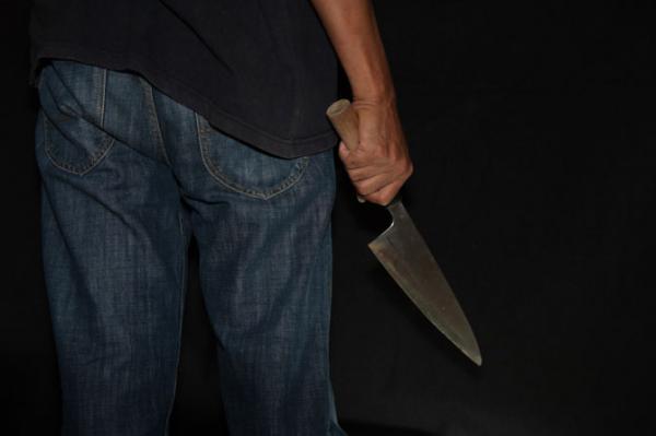 Man hacks wife with sickle inside office
