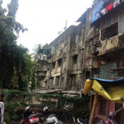 Why do some Mumbaikars continue to live in dilapidated buildings?