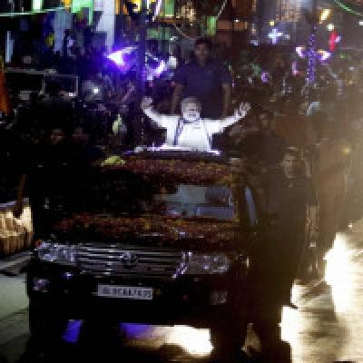 PM Modi holds mega roadshow, thousands line up to greet him