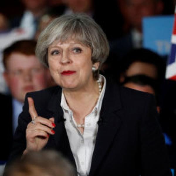A mourning Britain votes today: Will May win in June?