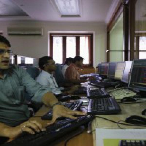 Sensex ends at record closing high, up 124 pts; Nifty fails to hold 9700