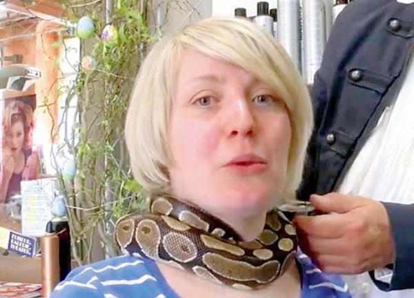 Monty, the python gives soothing massage at a salon in Germany