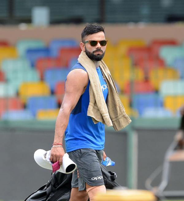 Who is the mystery girl with Virat Kohli in this photo?