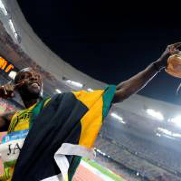 Usain Bolt warms up to run his last-ever 100-metre race