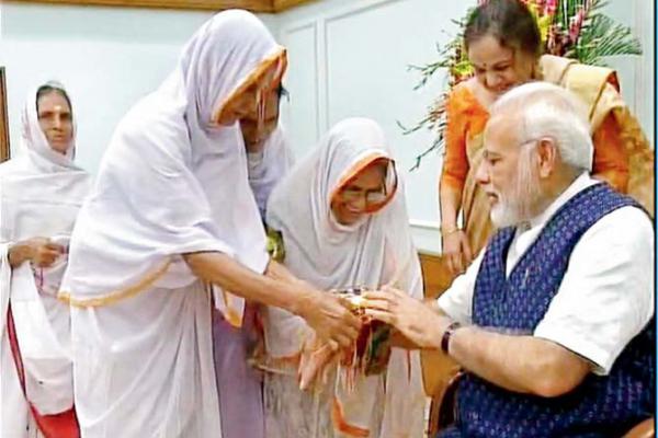 Widows from Vrindavan, students tie PM Narendra Modi rakhi in Delhi