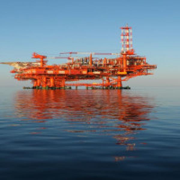 Oil rises as dollar drops, US Gulf Coast braces for hurricane