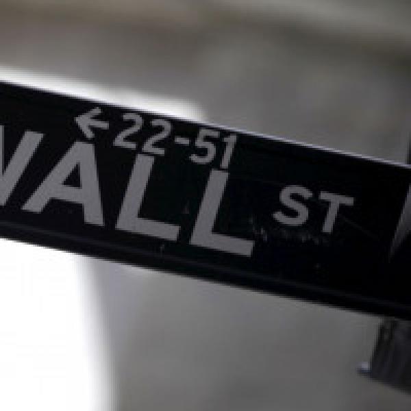 Wall Street ends flat as media stocks slump, healthcare gains