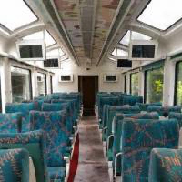 This Mumbai-Goa train compartment has a glass roof, LCD screens and rotating seats