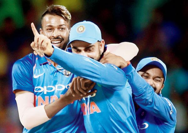 Virat Kohli has a broad smile on his face, and the Indian bowlers are the reason