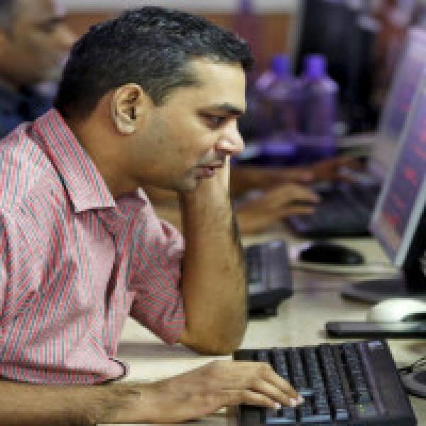 Sensex, Nifty end rangebound session lower as investors await Fed meet outcome