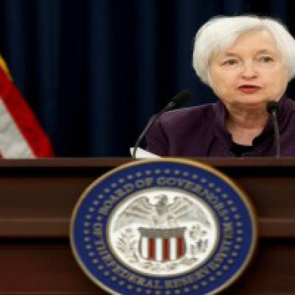Fed keeps US rates steady but signals increase by year-end