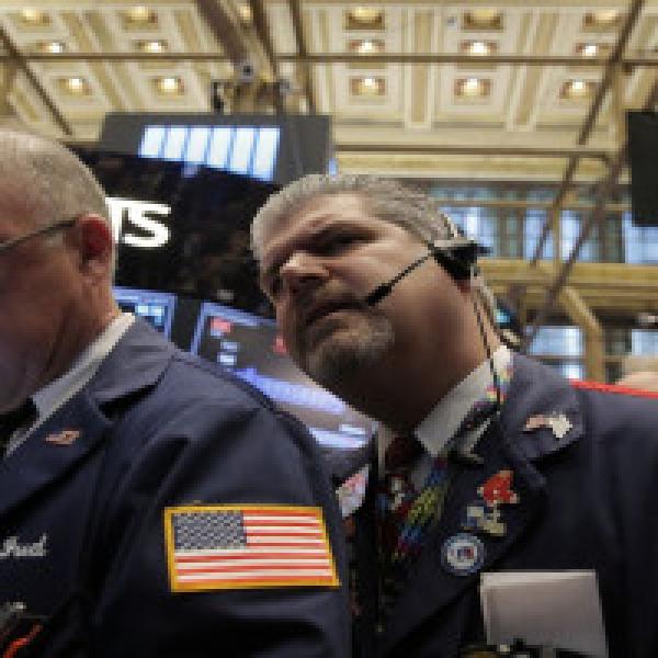 Stocks retreat from record highs as earnings season kicks into full gear
