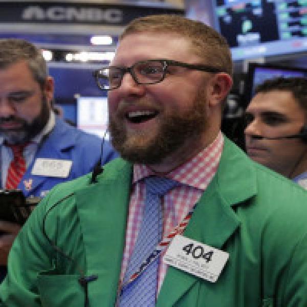 Dow ends above 23,000 for first time; IBM jumps