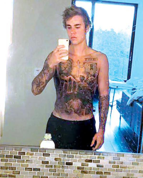 Justin Bieber gets his entire torso inked